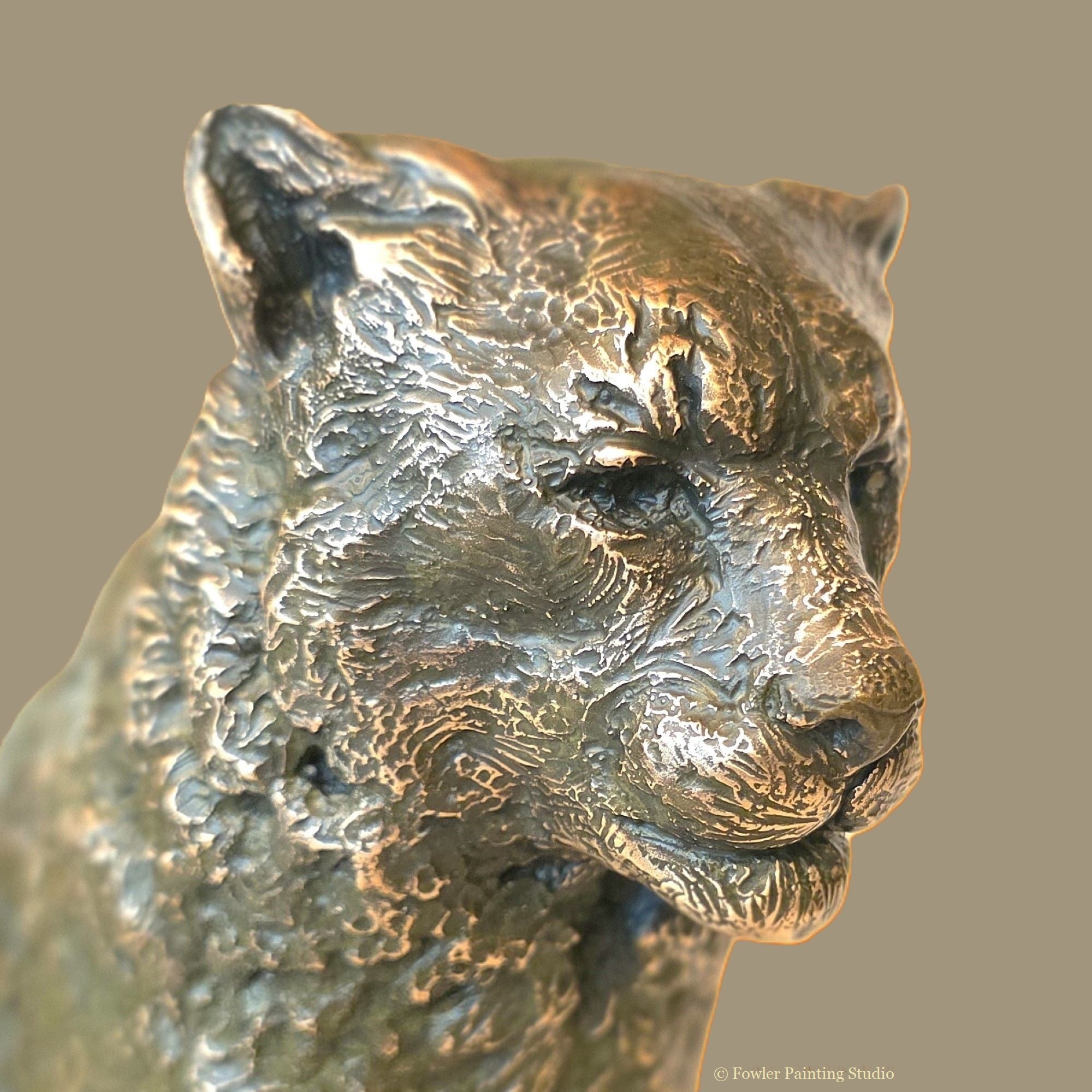 "Mist of the Mountains - the Snow Leopard" a bronze sculpture by artist, Jon Fowler.
