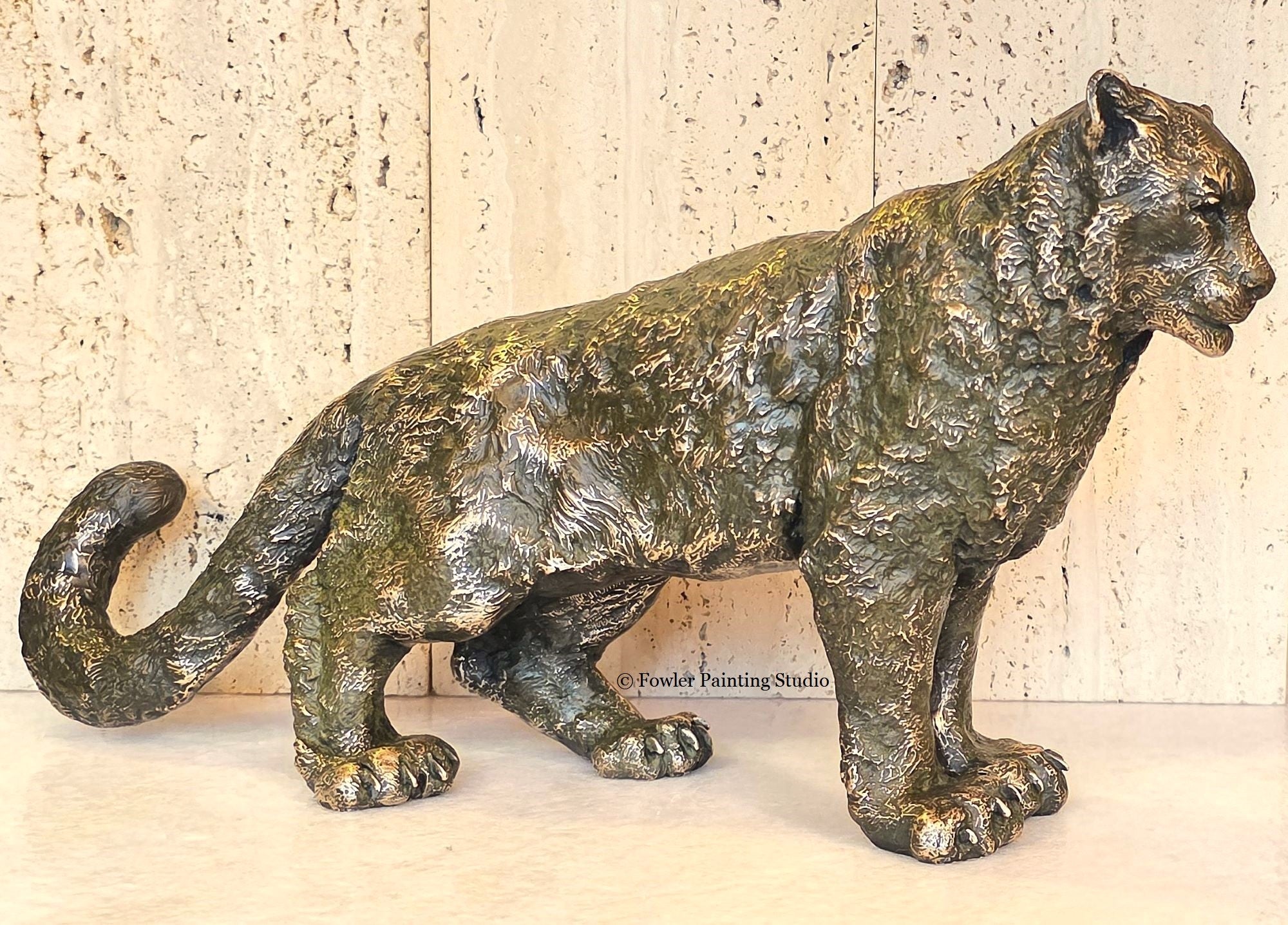 "Mist of the Mountains - the Snow Leopard" a bronze sculpture by artist, Jon Fowler.